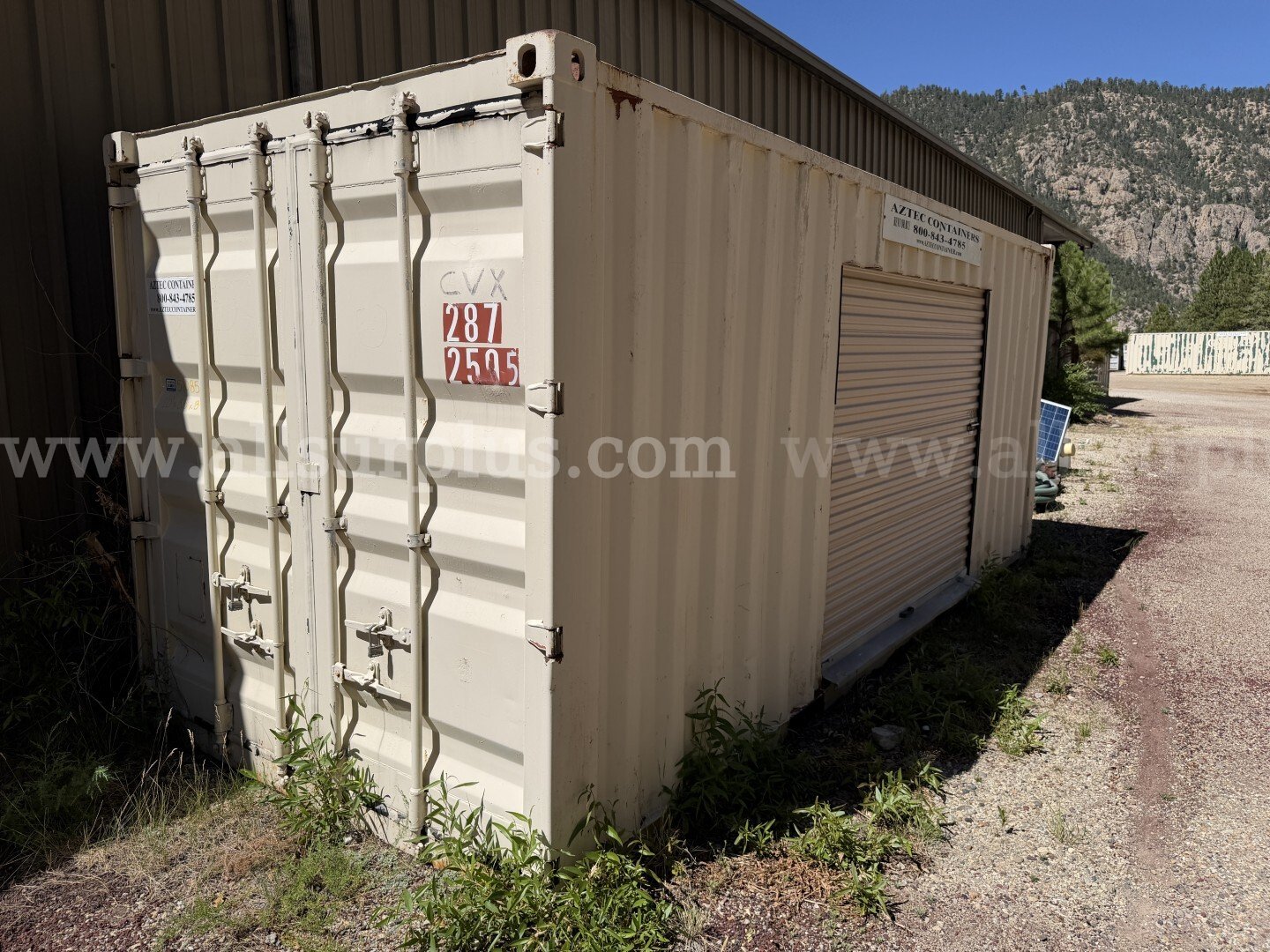 Shipping Container 20ft x 8.5ft x 8ft, Side Roll Up Door, With Contents, Qty 1   Government Surplus Auction - Primary Photo