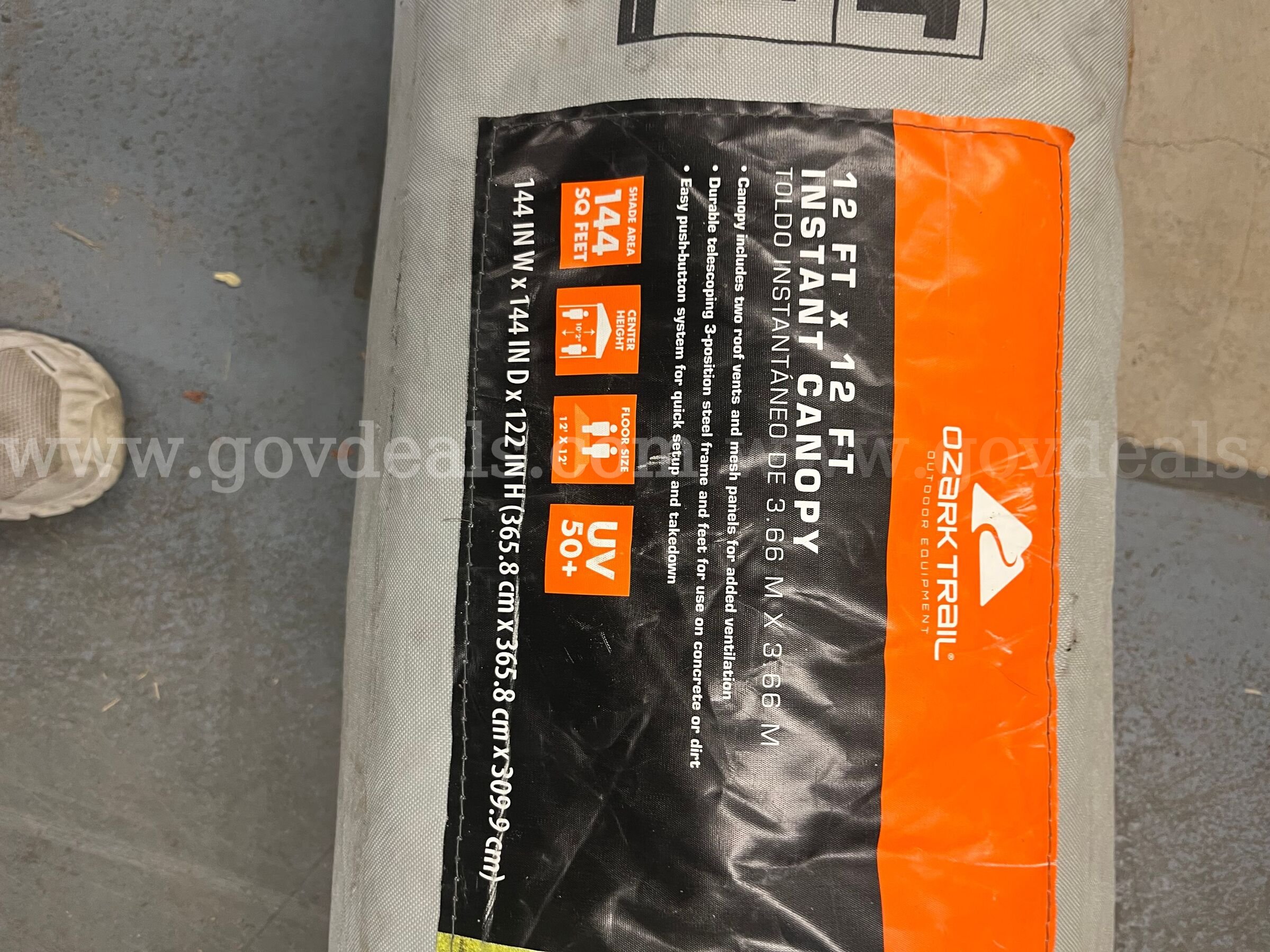 Brand: Ozark Trail Size: 12 ft x 12 ft canopy Covers up to 144 sq ft UV 50+ protection Ozark Trail 144 Government Surplus Auction - Photo #4
