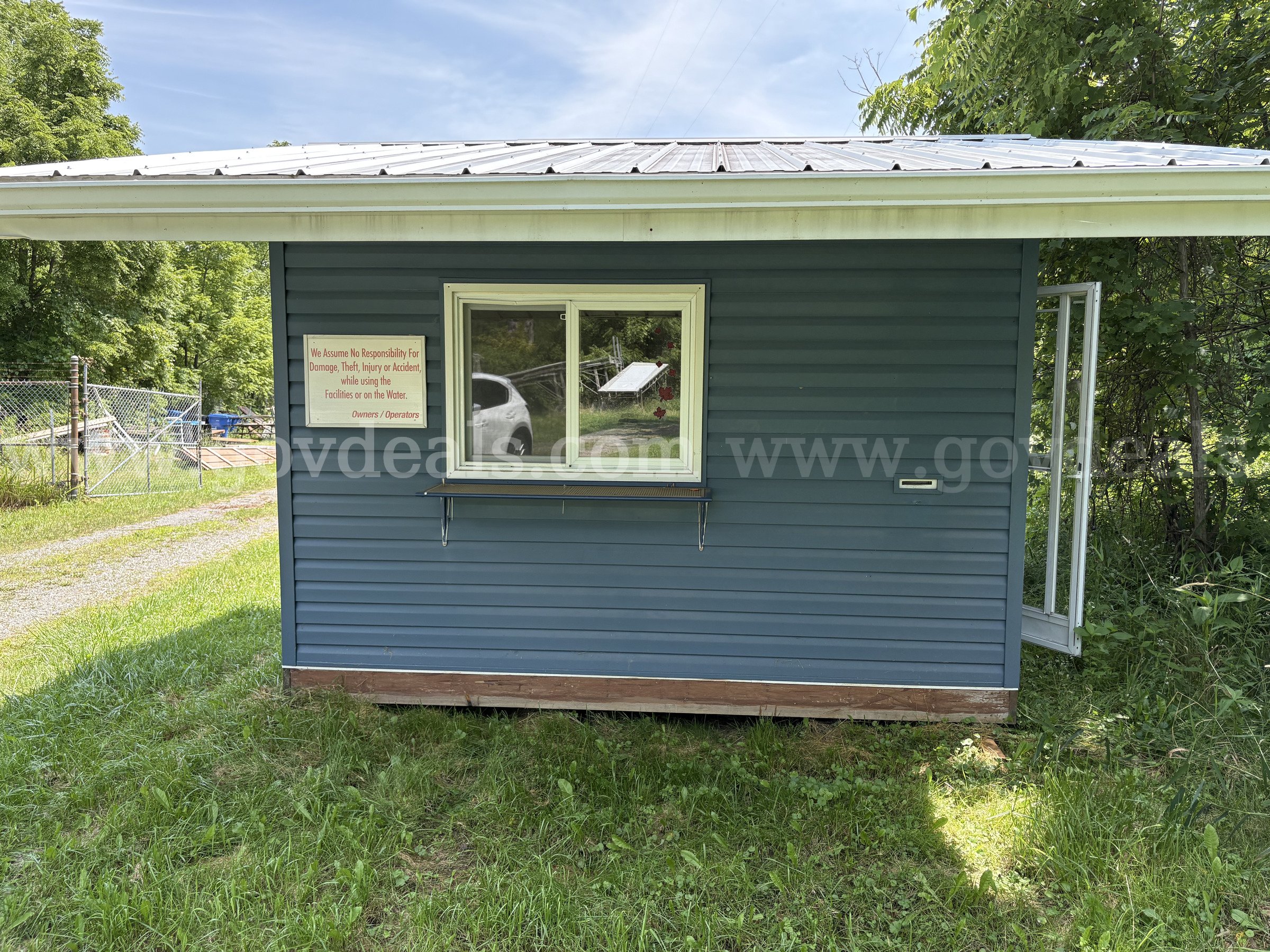 Service Booth Shed with Electrical Supply - 10.8 ft. x 12.3 ft. x 8.2 ft.   Government Surplus Auction - Primary Photo