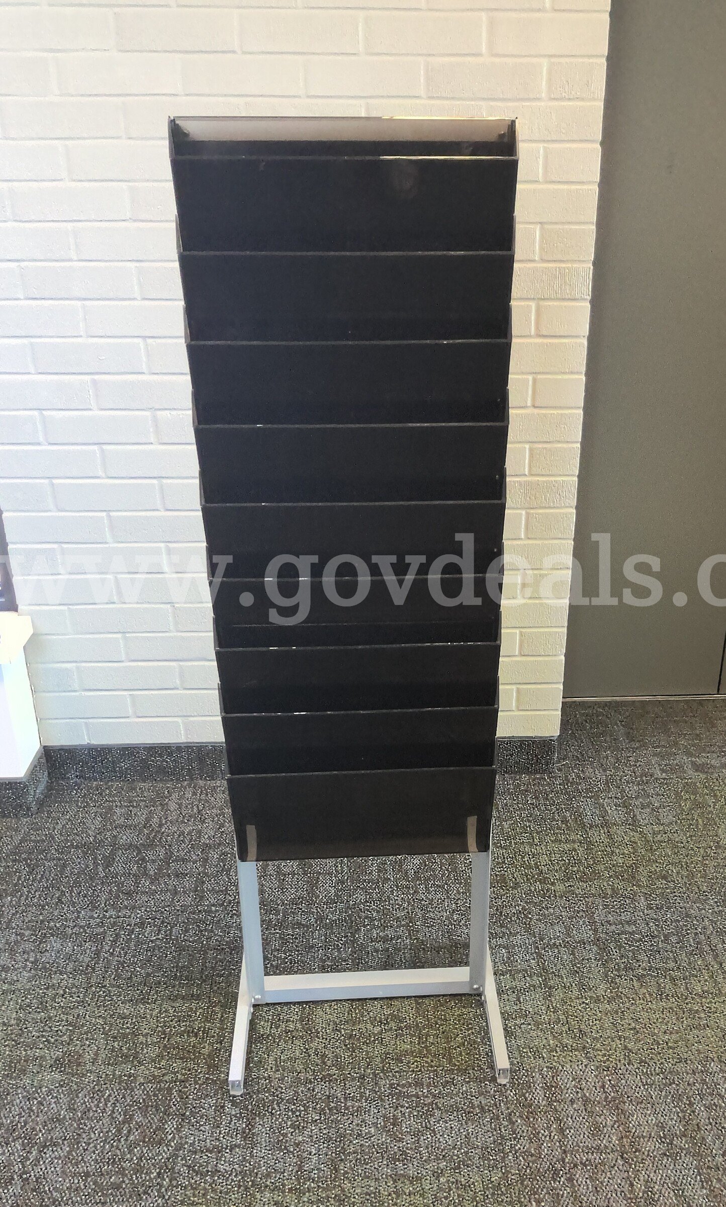 Free Standing Media Rack   Government Surplus Auction - Primary Photo