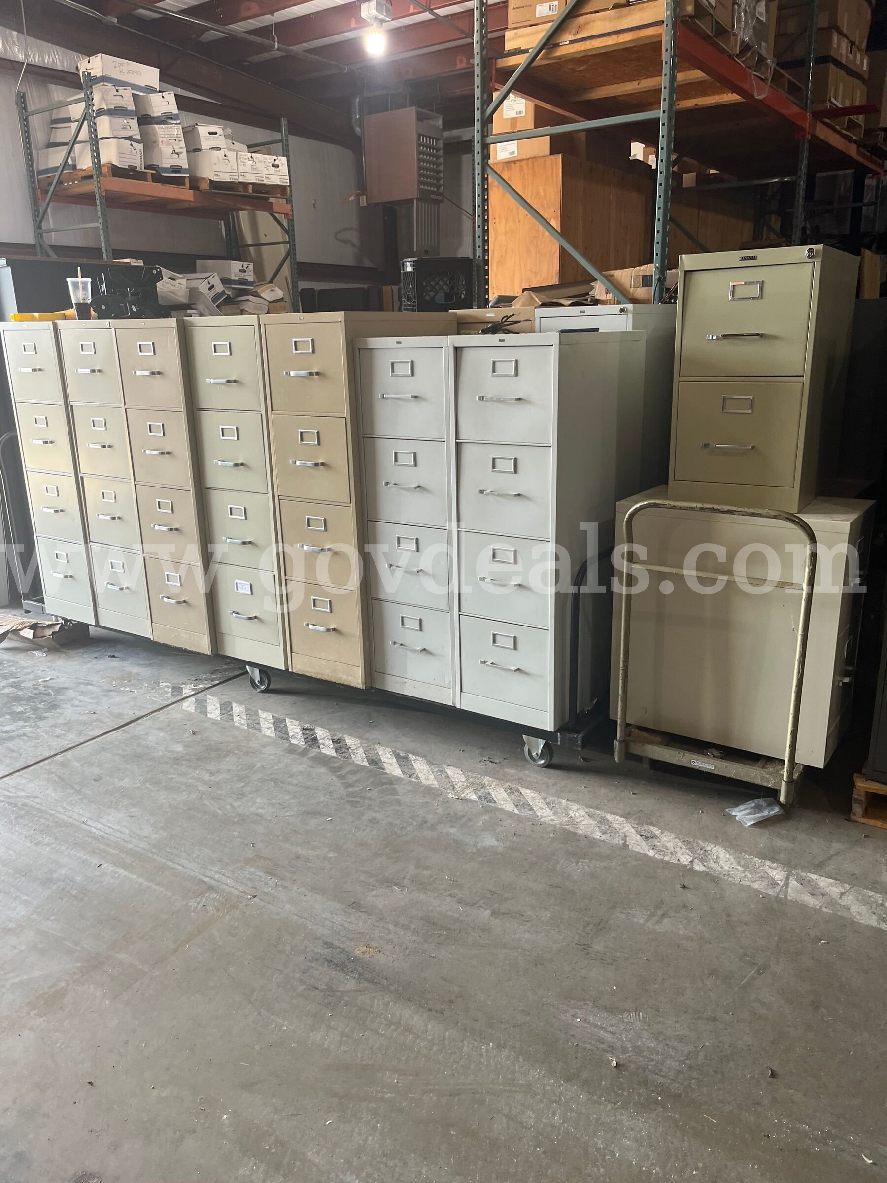 Lot of used filing cabinets.  Approx eighteen 4 drawer and three 2 drawer metal file cabinets.   Government Surplus Auction - Primary Photo