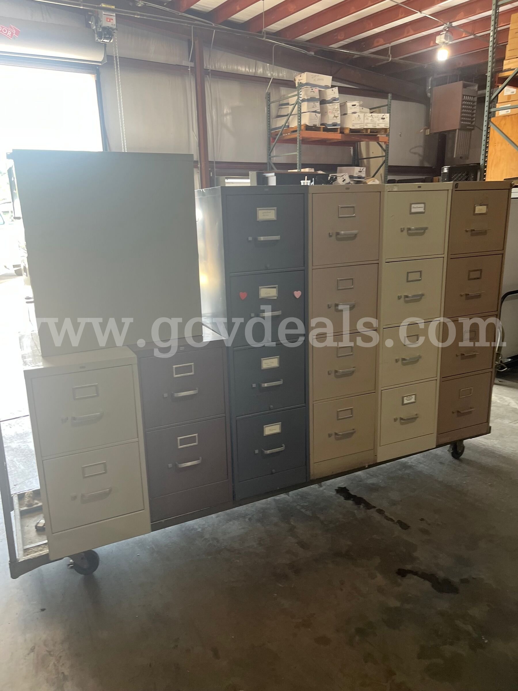 Lot of used filing cabinets.  Approx eighteen 4 drawer and three 2 drawer metal file cabinets.   Government Surplus Auction - Photo #2