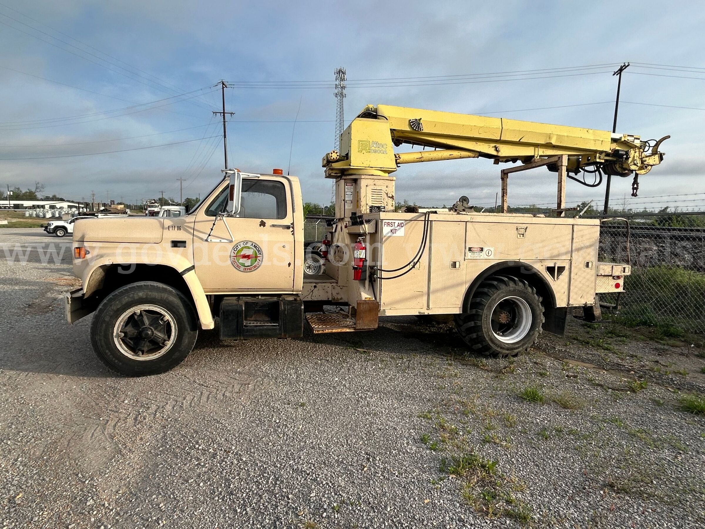 1986 Chevrolet Diesel with a front mounted digger derrick