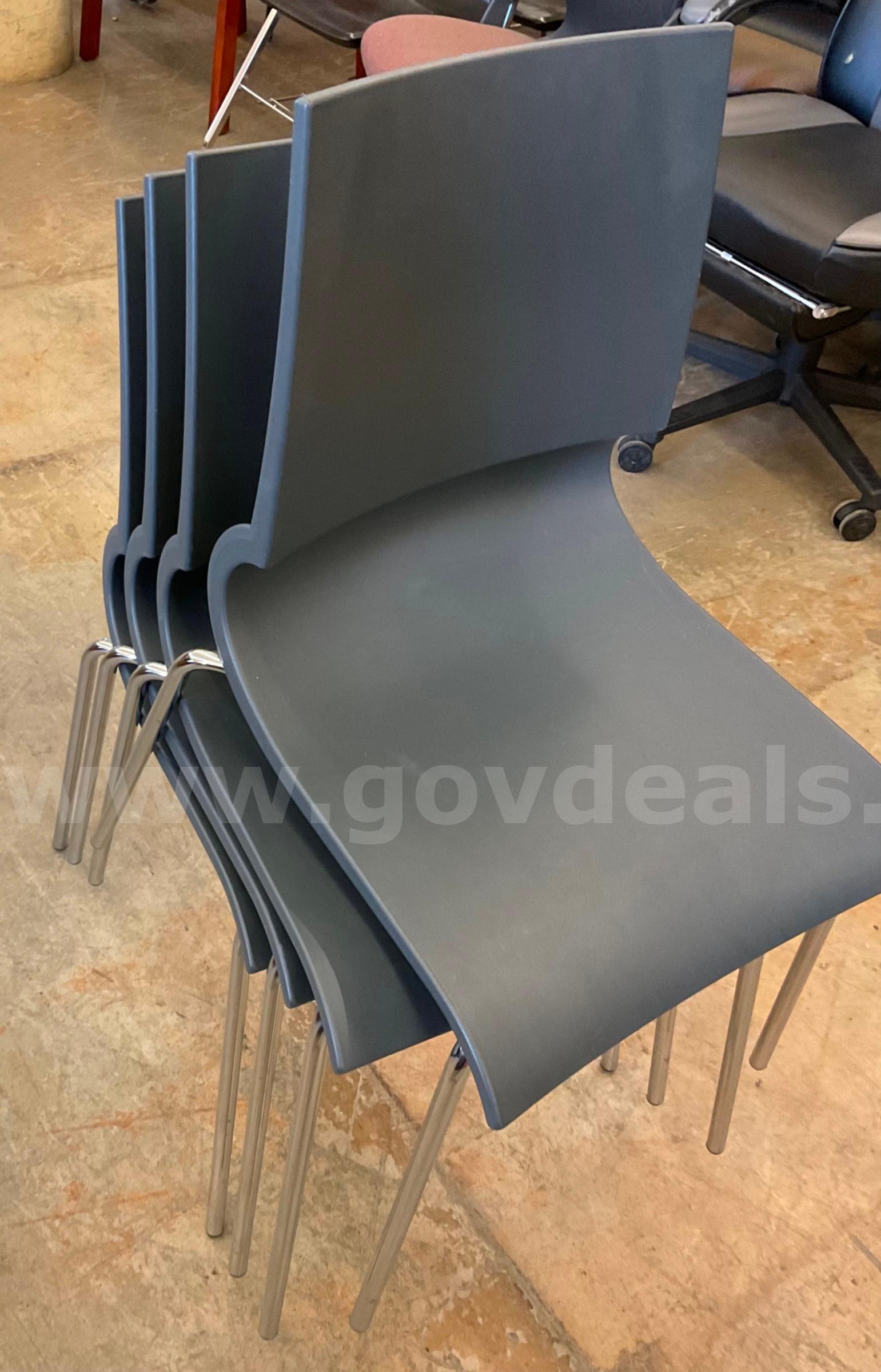lot of 4 grey plastic chairs   Government Surplus Auction - Primary Photo