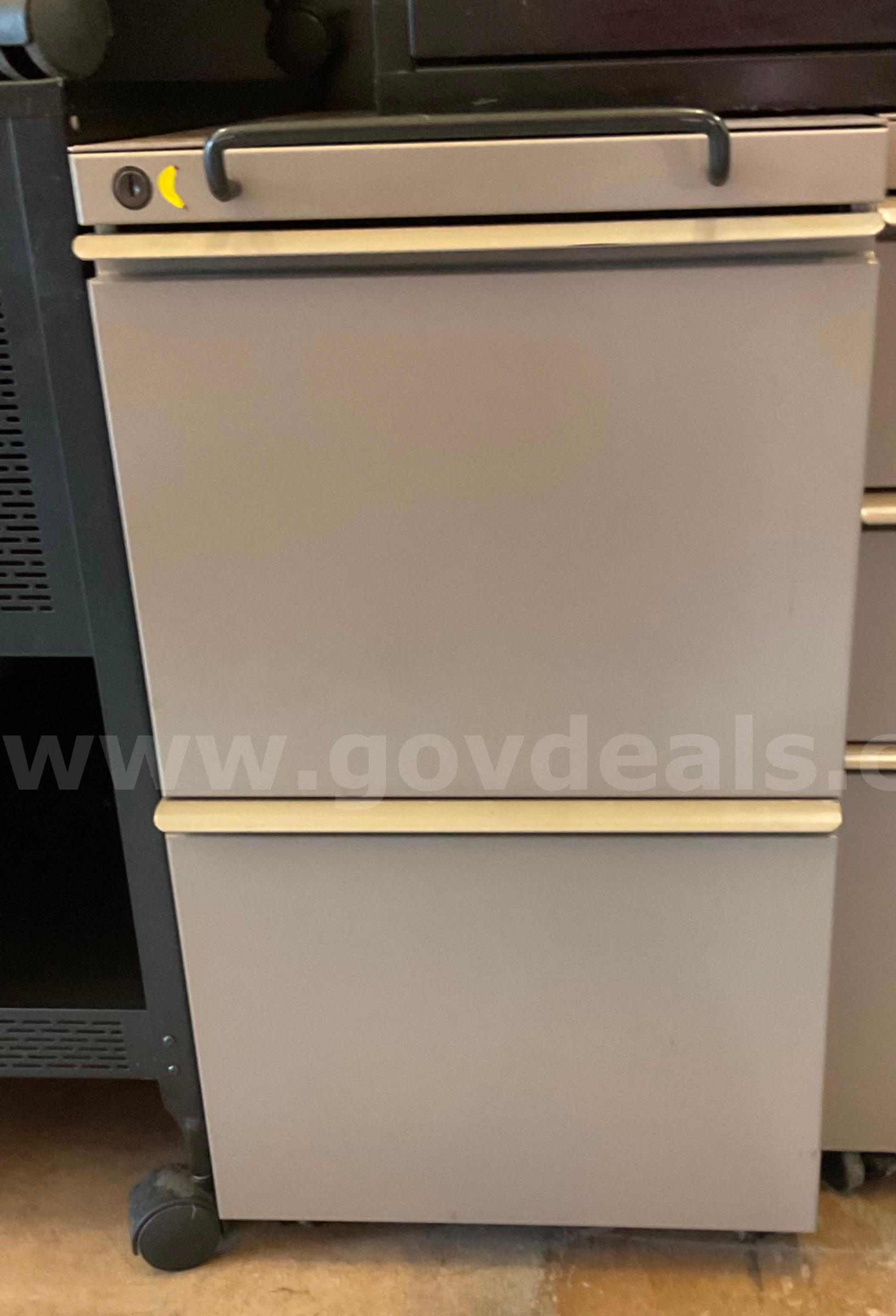 Tan 2 drawer filing cabinet   Government Surplus Auction - Primary Photo