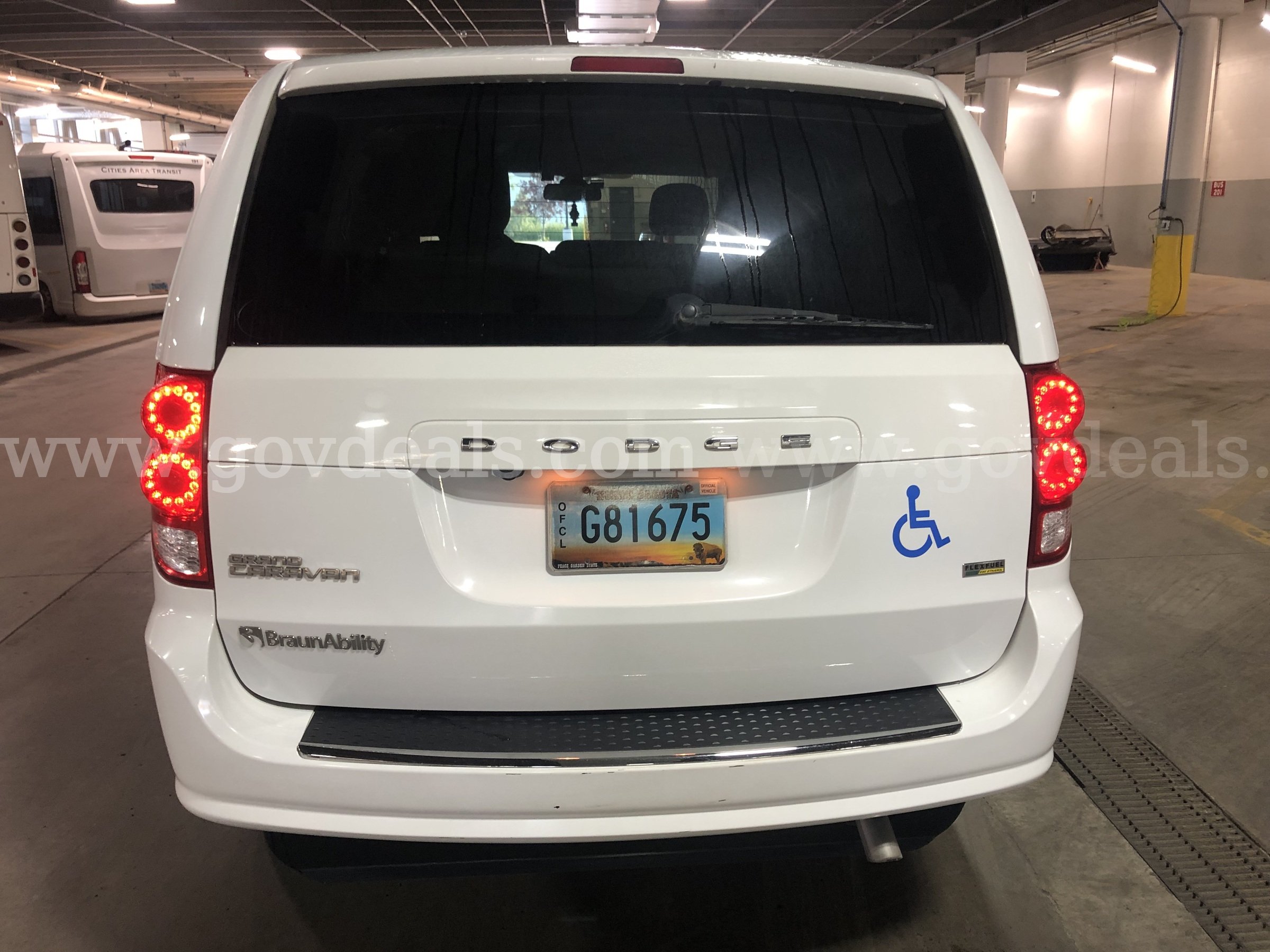 2019 White Dodge Caravan(Entervan), Wheelchair accessible with a manual pull out ramp. In Good condition. Dodge Caravan(Entervan) Government Surplus Auction - Photo #2