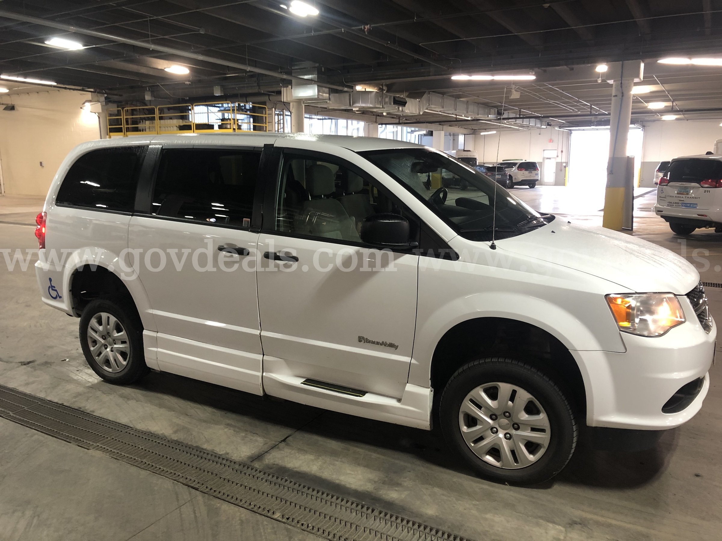 2019 White Dodge Caravan(Entervan), Wheelchair accessible with a manual pull out ramp. In Good condition. Dodge Caravan(Entervan) Government Surplus Auction - Photo #3