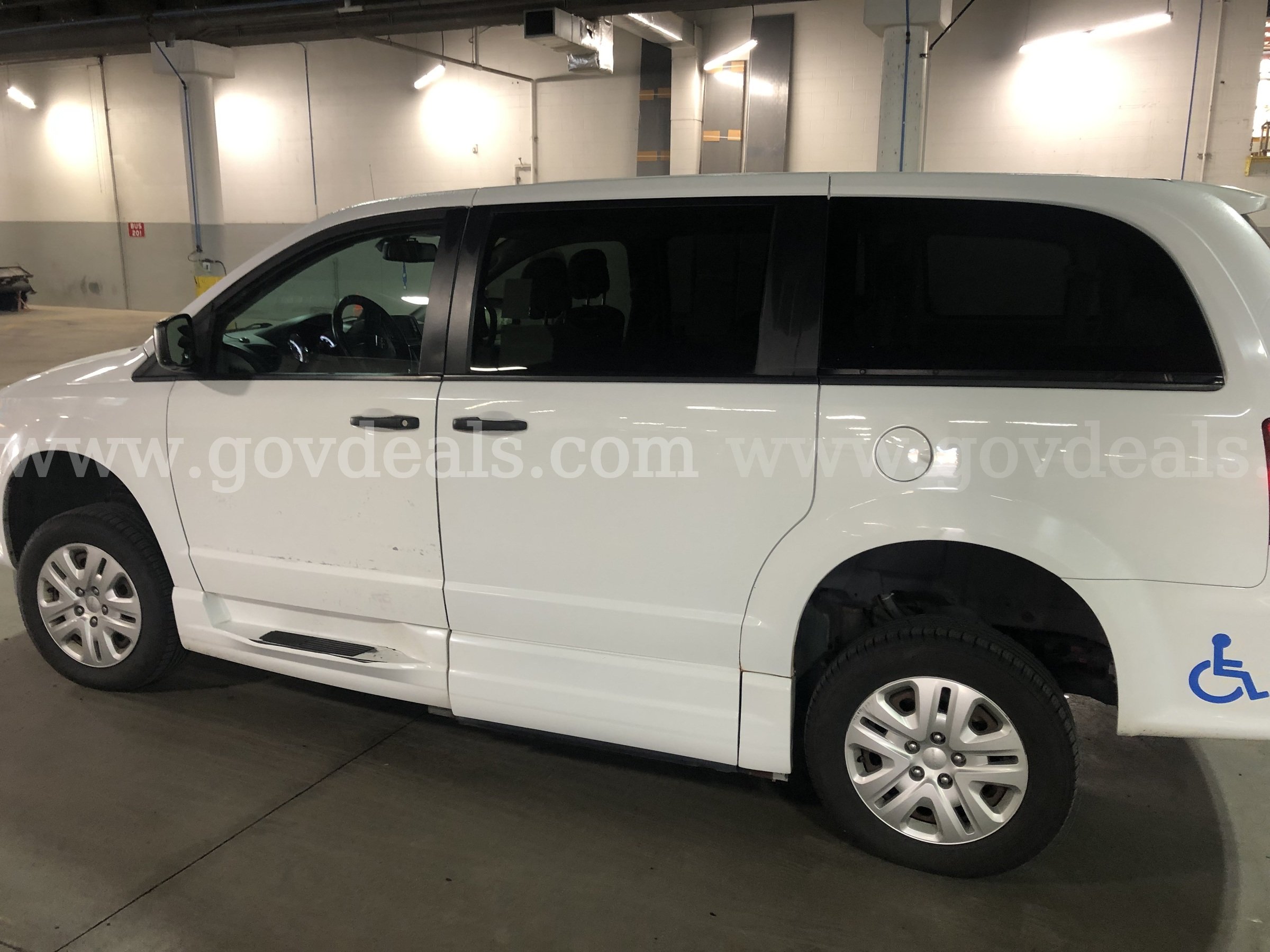 2019 White Dodge Caravan(Entervan), Wheelchair accessible with a manual pull out ramp. In Good condition. Dodge Caravan(Entervan) Government Surplus Auction - Photo #4