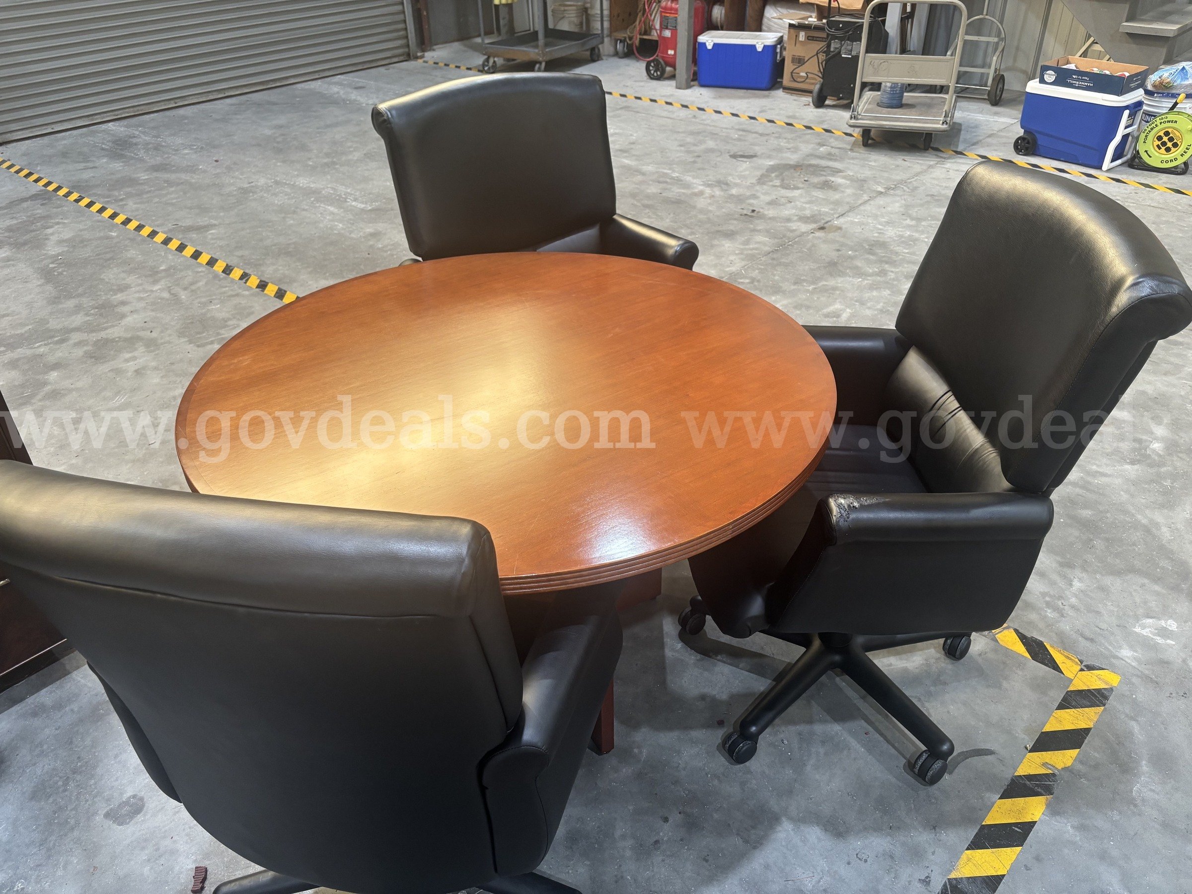 Round Cherry Office Table + Three Rolling Executive Chairs   Government Surplus Auction - Primary Photo